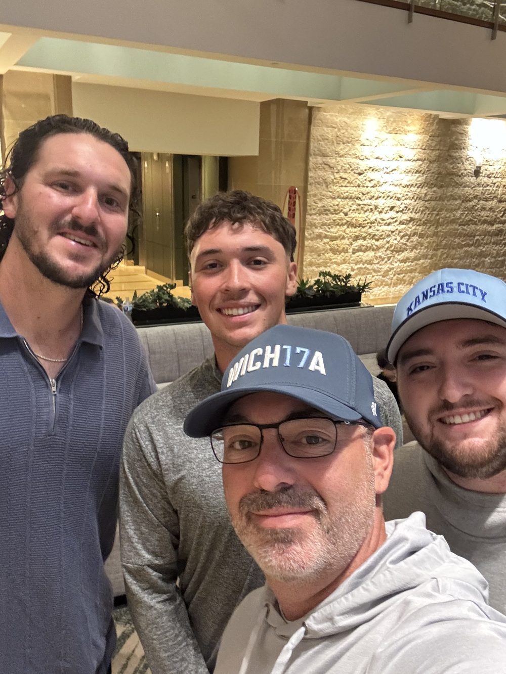 Aaron, his son Brett, and Luke with Kansas City Royals first baseman Vinnie Pasquantino